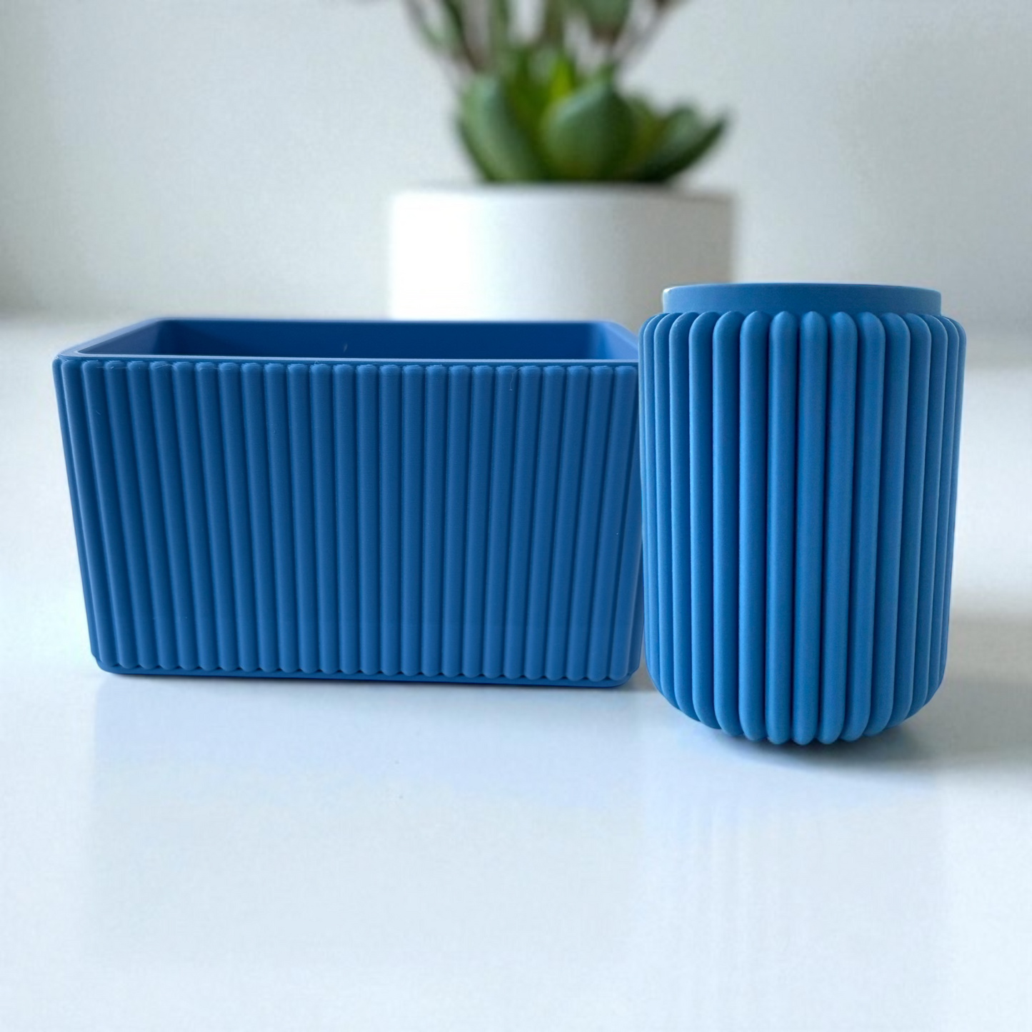 Modern blue ribbed desk tidy duo organizing pens and accessories