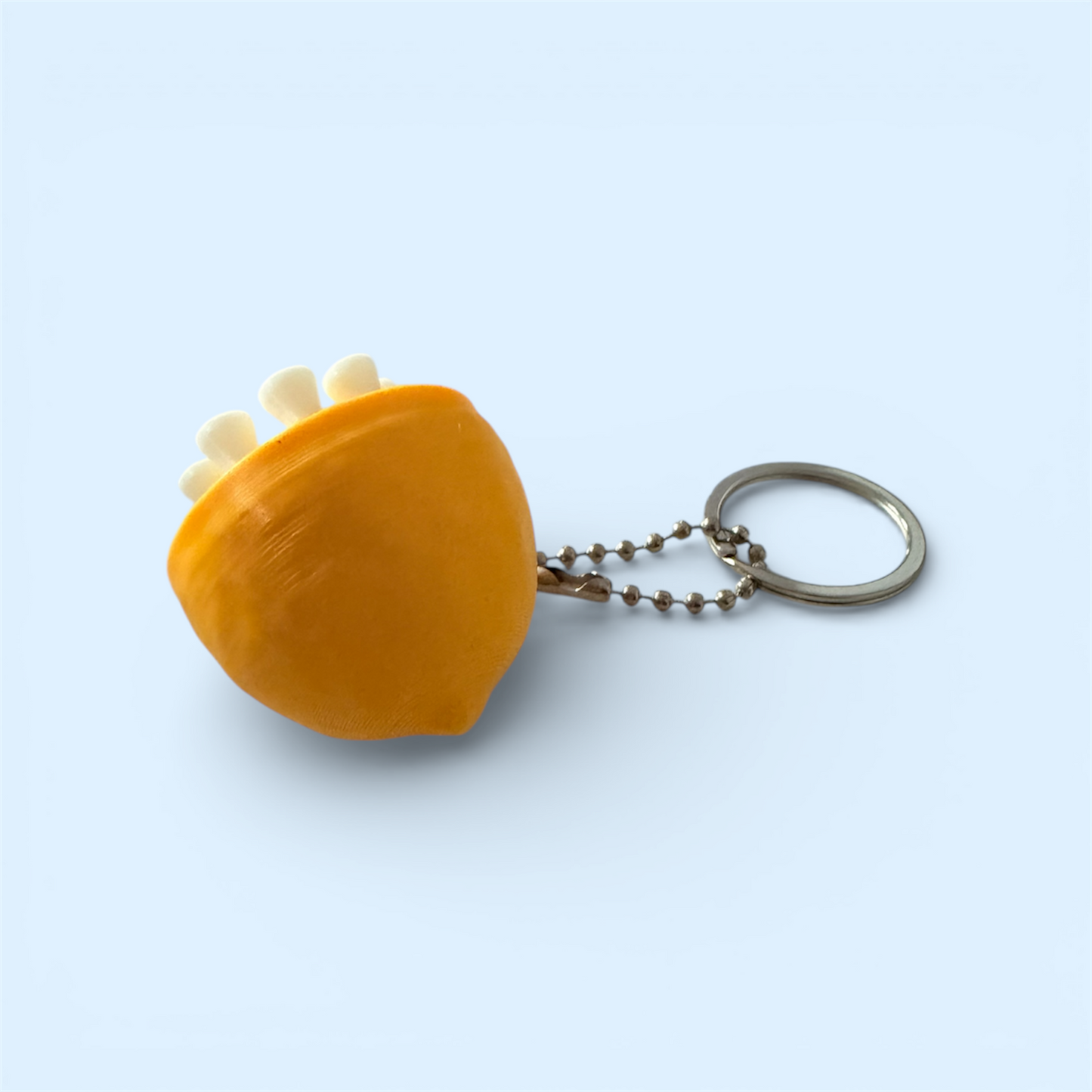 GOLFING TEE LEMON CLICKER KEYCHAIN
