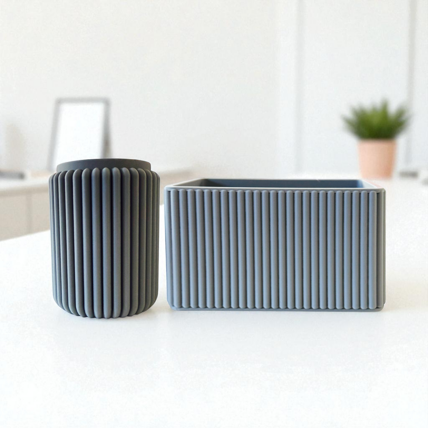 2 grey plastic desk pots