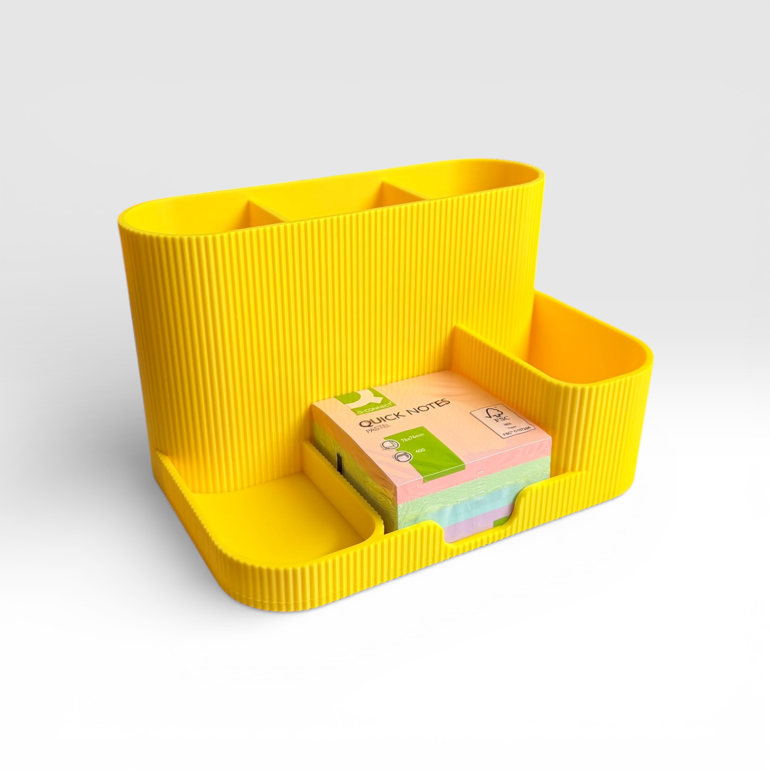 Bright lemon desk organiser and sticky note holder with multiple compartments for stationery