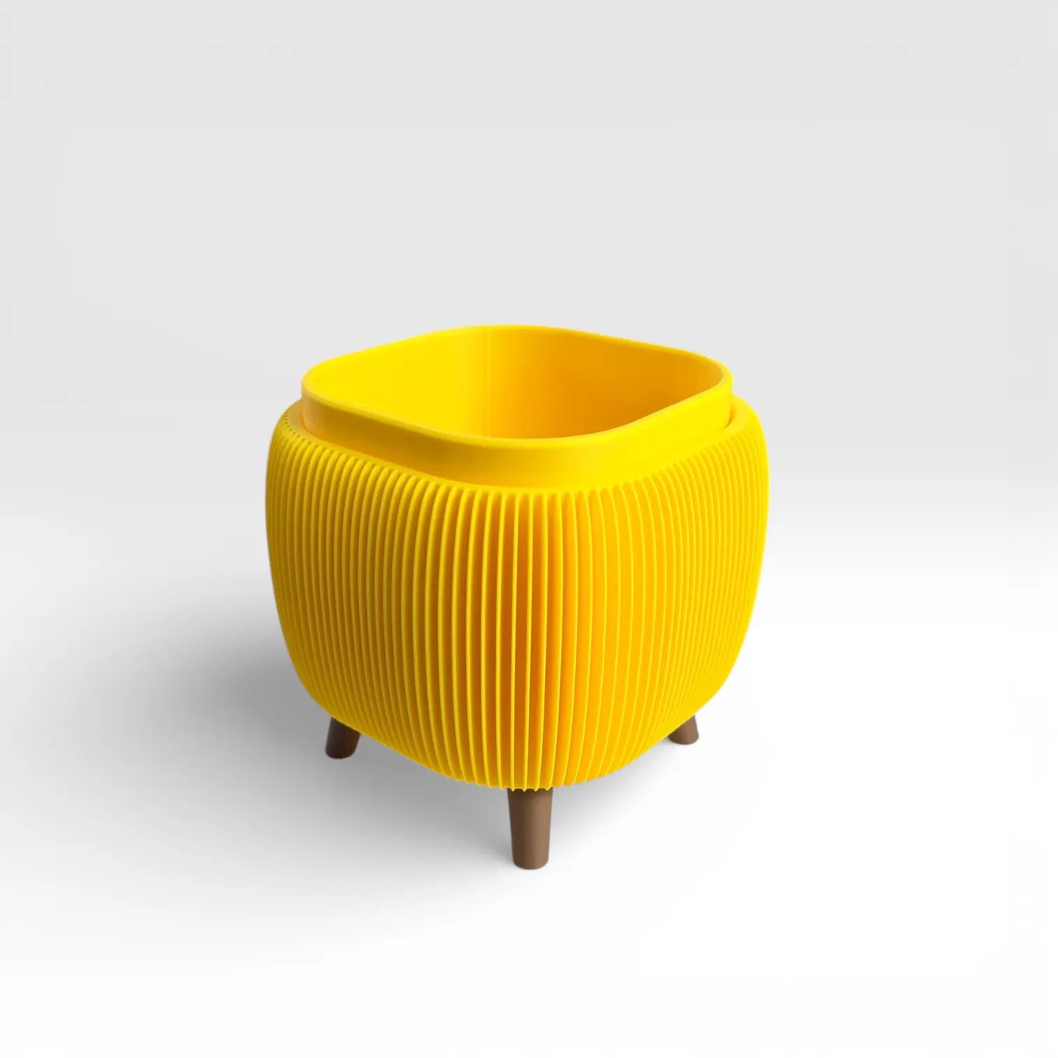 Bright yellow retro rounded square planter with ribbed texture and drainage liner for indoor plants
