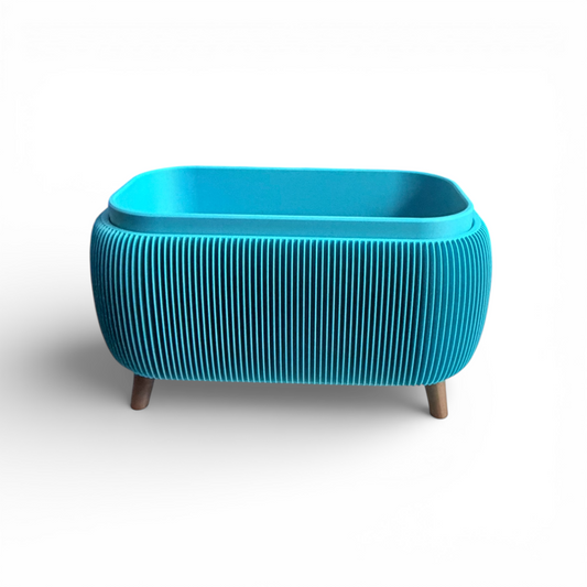 Turquoise retro rounded oblong planter with ribbed texture and raised feet for indoor plants