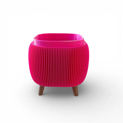 Retro Rounded Square Planter in raspberry with ribbed texture and raised feet for indoor plants