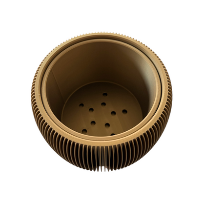 A round, ribbed metal container or filter basket with a perforated bottom, shown from a top-down perspective on a solid white background.